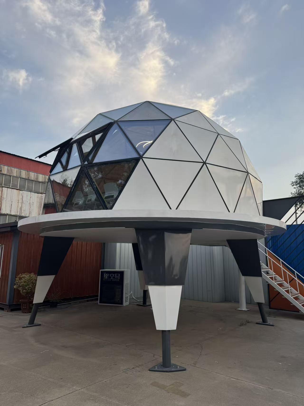 Side angle of the bahria homes House C7 Plus elevated dome pod with geometric glass and metal panels, showcasing modern modular smart home design by bahria homes Castle.