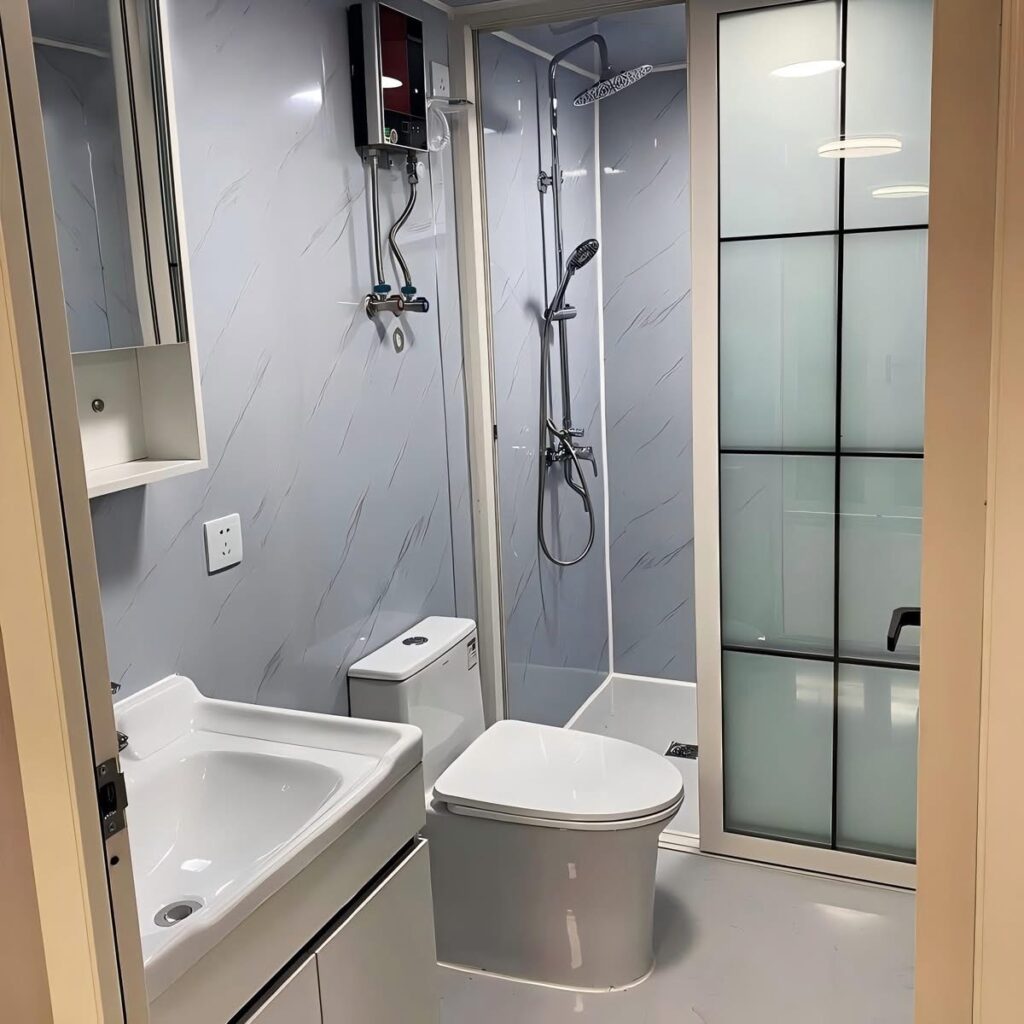 Modern bathroom inside bahria homes Castle Expandable House E20 featuring shower, toilet, and sink in a compact modular home layout