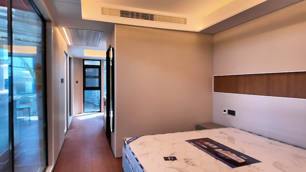 Interior of the bahria homes House D8 featuring a sleek, modern bathroom design with a smart toilet, wall-mounted sink, and soft ambient lighting.